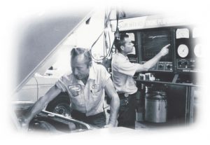 Connie & Dick performing auto repair