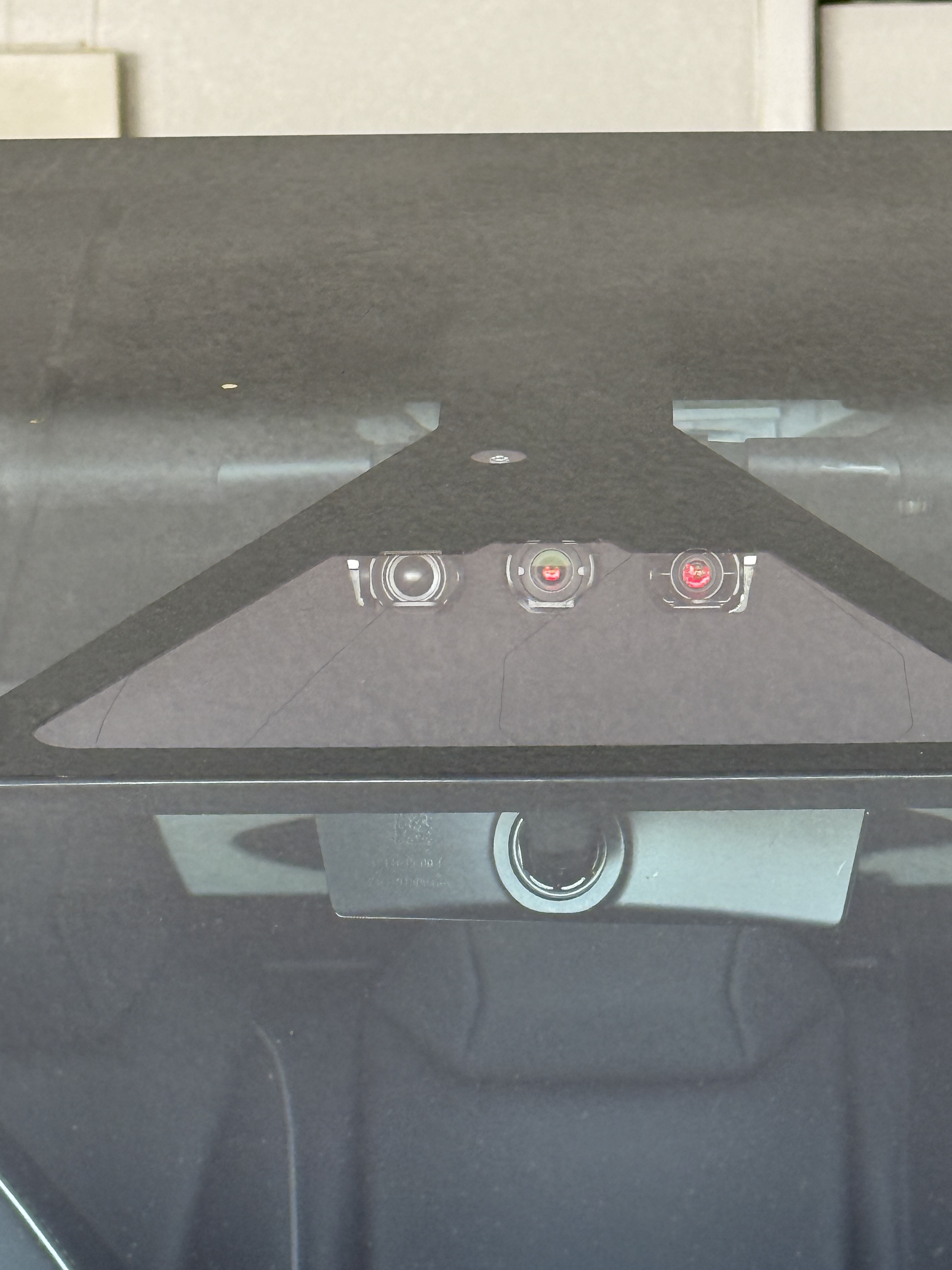 Image of a forward facing camera mounted behind the windshield on a Tesla Cybertruck